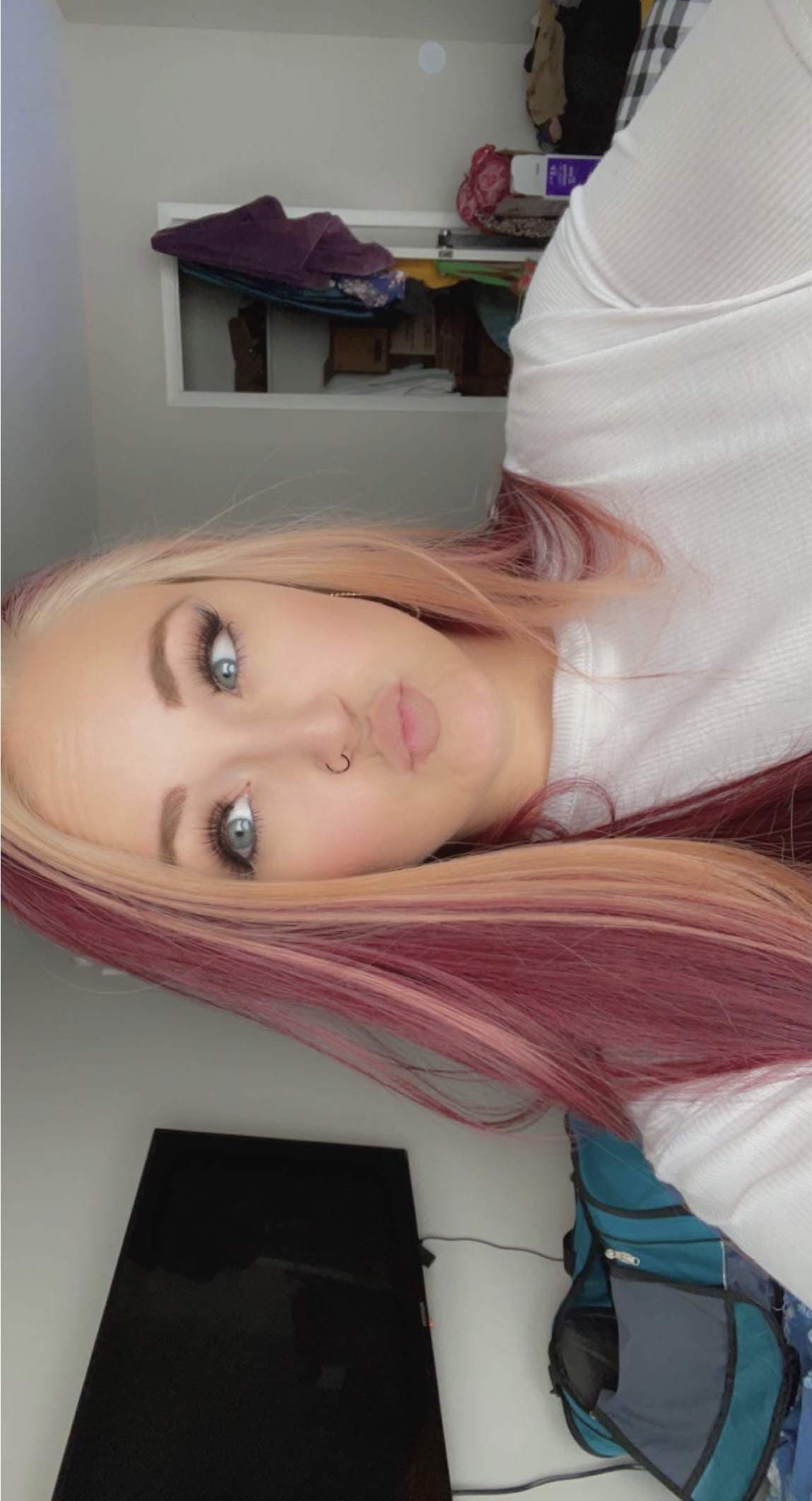 T.